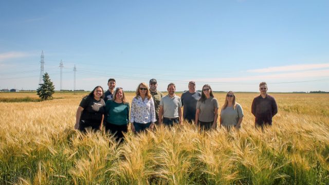 group of EMILI staff members standing in field